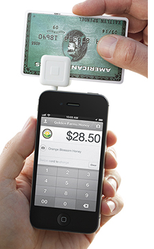 Running a credit card through the square reader