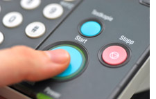 Finger on a printer button